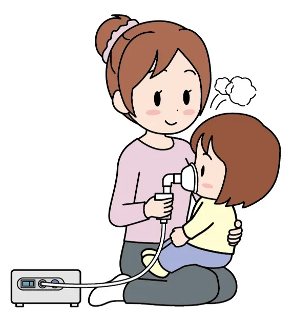 お子さまに吸入治療をしている様子